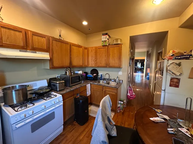 a kitchen with a sink appliances and cabinets