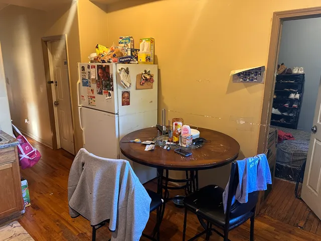 a view of a dining room with furniture and chandelier