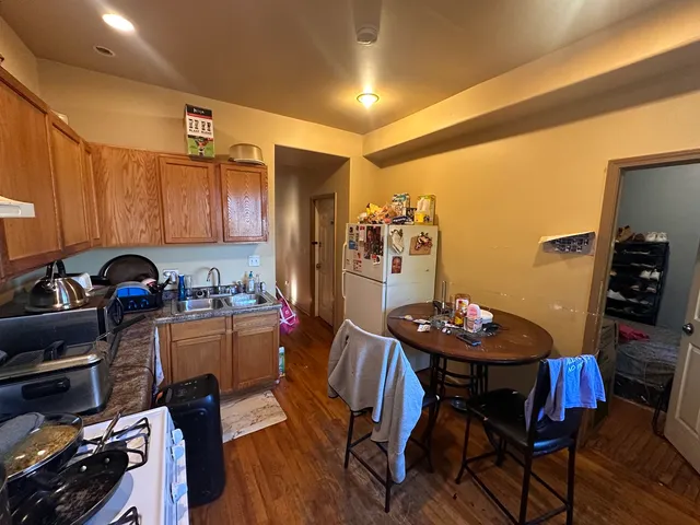 a kitchen with a table and chairs in it