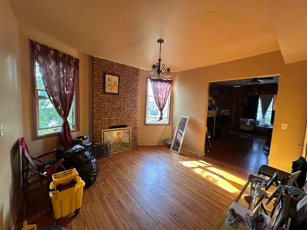 a living room with furniture windows and a fireplace
