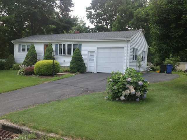 36 Milton Drive Meriden, CT 06450 - Photo 1 of 1 a front view of a house with a garden and porch