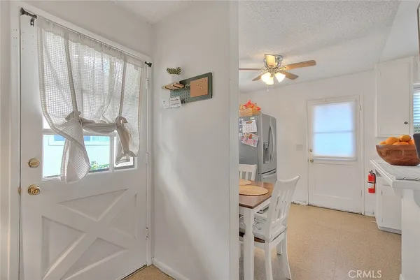 a kitchen with white cabinets and a sink
