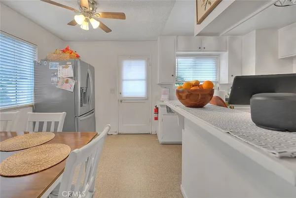 a living room with furniture and a lamp