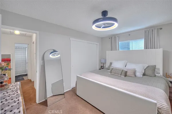 a kitchen with granite countertop a sink a stove and cabinets
