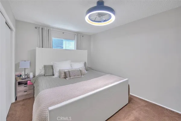 a kitchen with kitchen island granite countertop wooden cabinets a sink and dishwasher