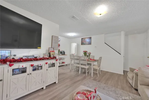 a car parked in front of a white house