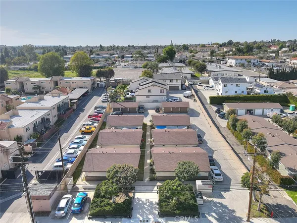 an aerial view of residential houses with outdoor space
