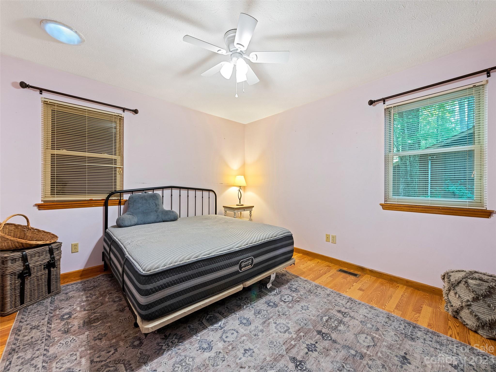 260 Reuben Branch Road Maggie Valley, NC 28751 - Photo 19 of 24 a bedroom with a bed and window