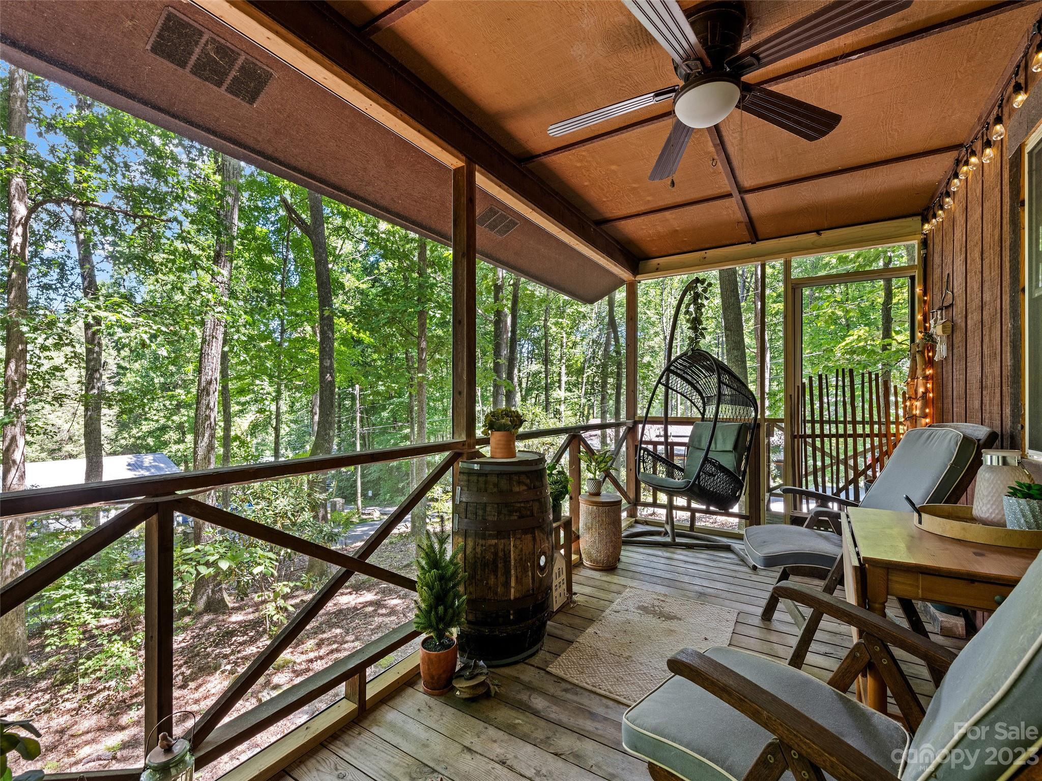 260 Reuben Branch Road Maggie Valley, NC 28751 - Photo 6 of 24 a view of a balcony with furniture