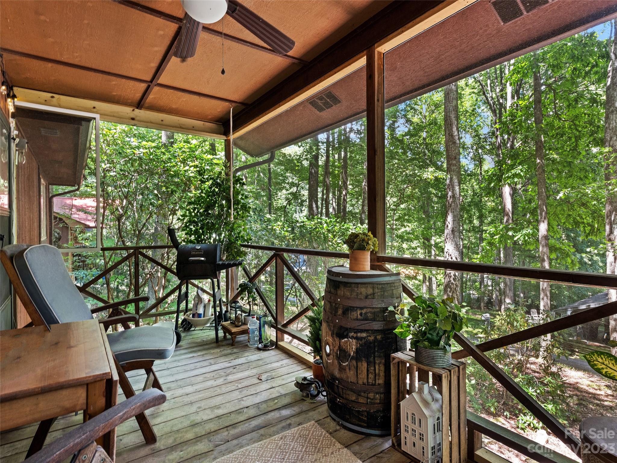 260 Reuben Branch Road Maggie Valley, NC 28751 - Photo 7 of 24 a view of a balcony with chairs