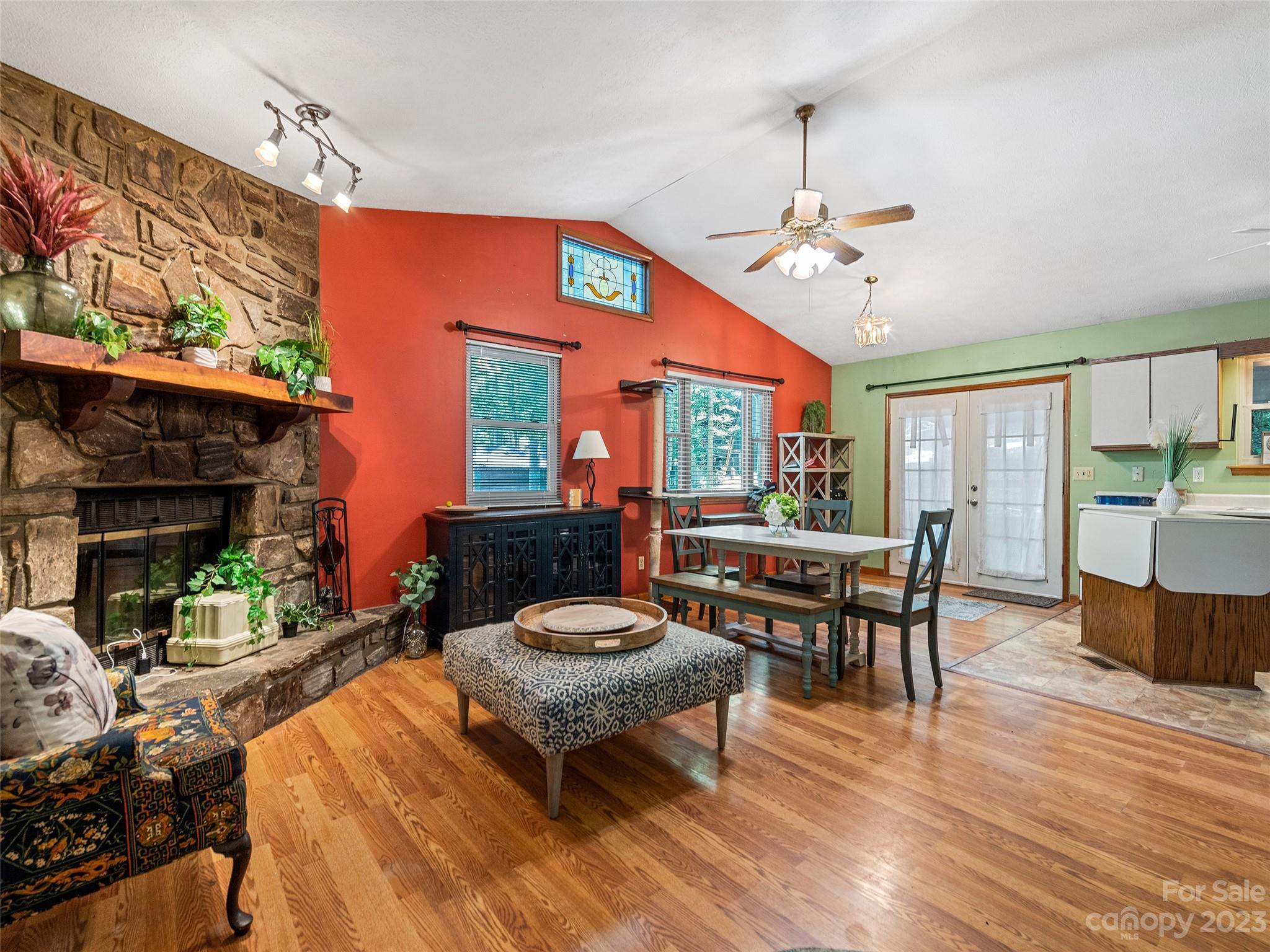 260 Reuben Branch Road Maggie Valley, NC 28751 - Photo 9 of 24 a living room with furniture a fireplace and a table