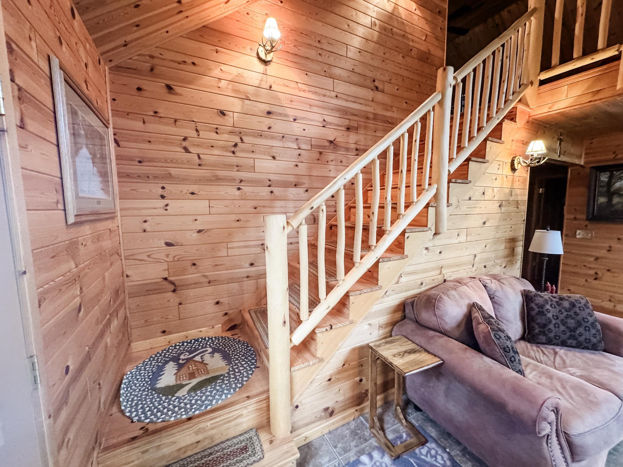 11466 Westerlund Loop Solon Springs, WI 54873 - Photo 21 of 55 Staircase with wooden walls and wood ceiling
