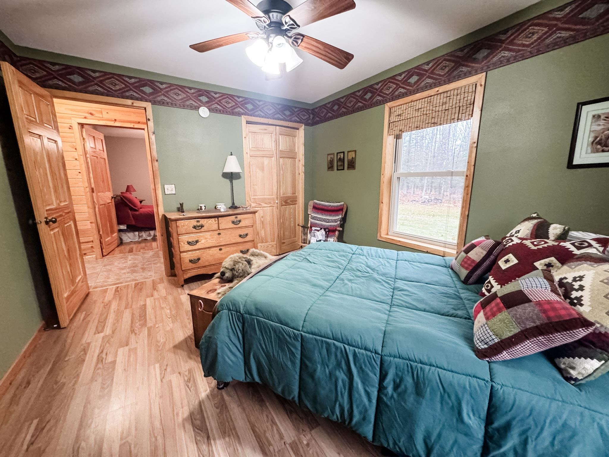 11466 Westerlund Loop Solon Springs, WI 54873 - Photo 34 of 55 Bedroom featuring light wood-type flooring, a closet, and a ceiling fan