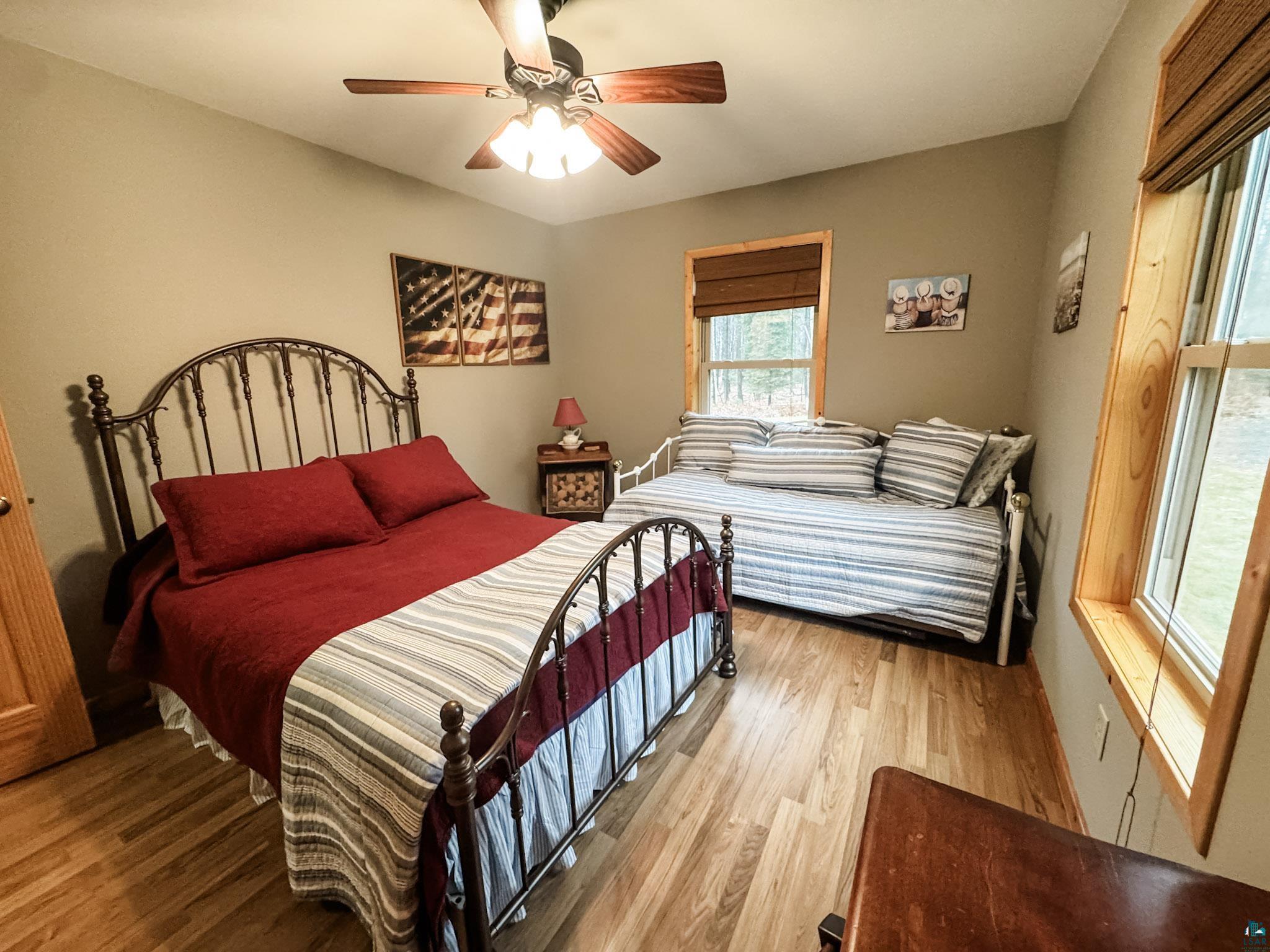 11466 Westerlund Loop Solon Springs, WI 54873 - Photo 36 of 55 Bedroom featuring wood finished floors and a ceiling fan