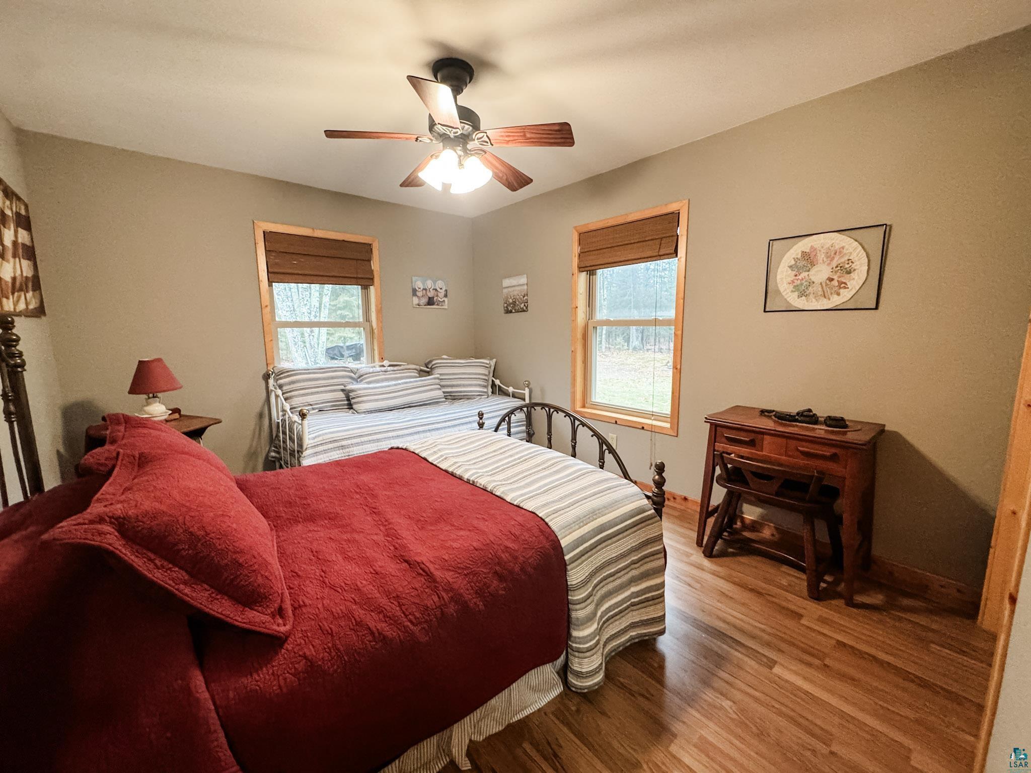11466 Westerlund Loop Solon Springs, WI 54873 - Photo 37 of 55 Bedroom with wood finished floors and ceiling fan
