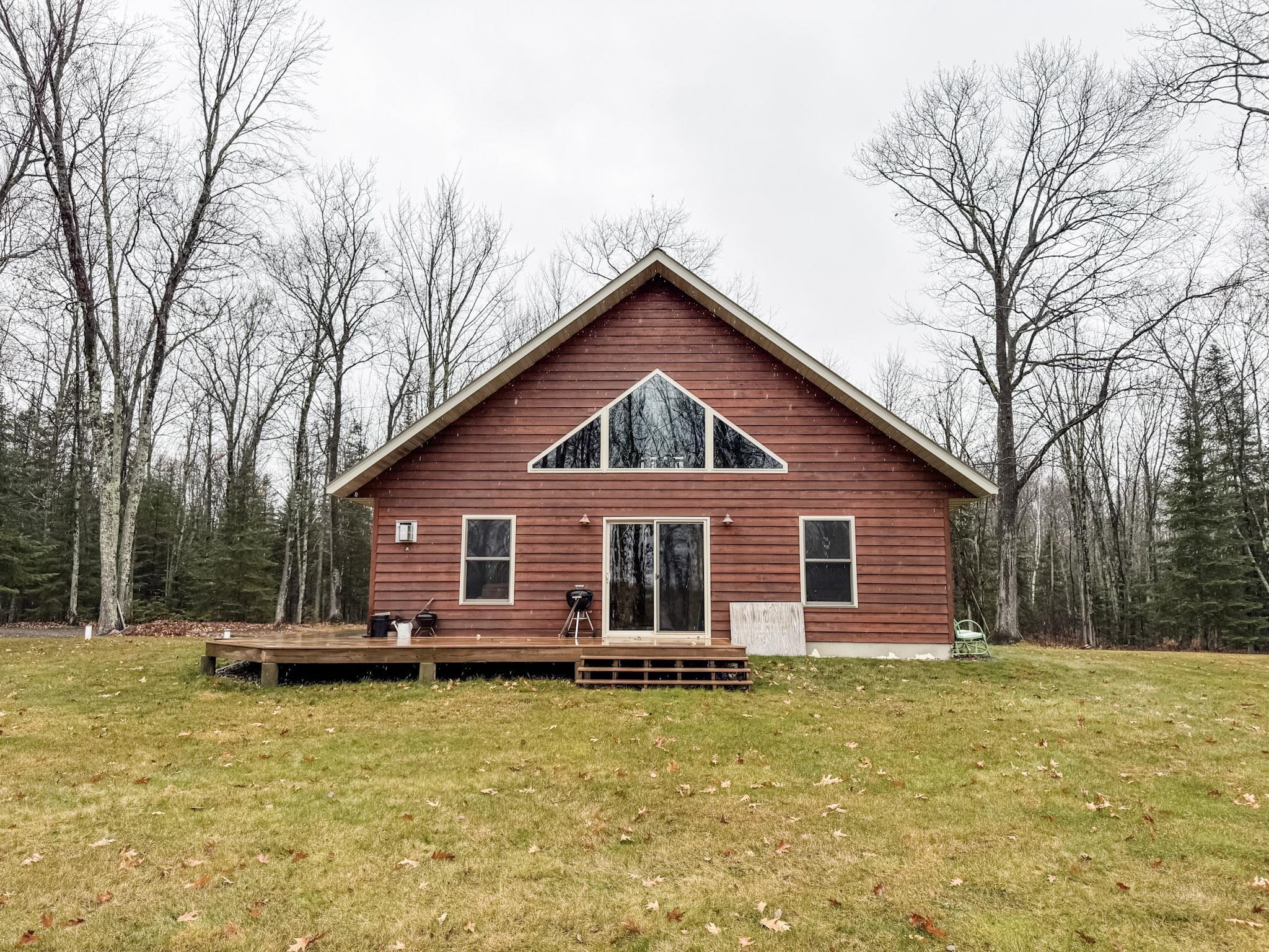11466 Westerlund Loop Solon Springs, WI 54873 - Photo 4 of 55 Rear view of house with a deck and a yard