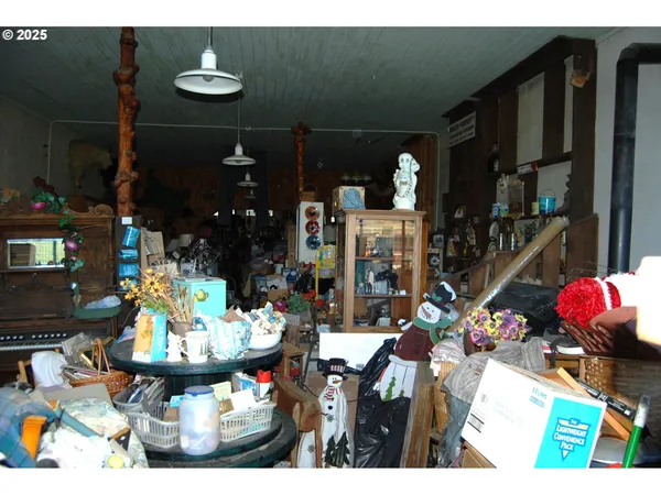 a group of people sitting in front of retail shop