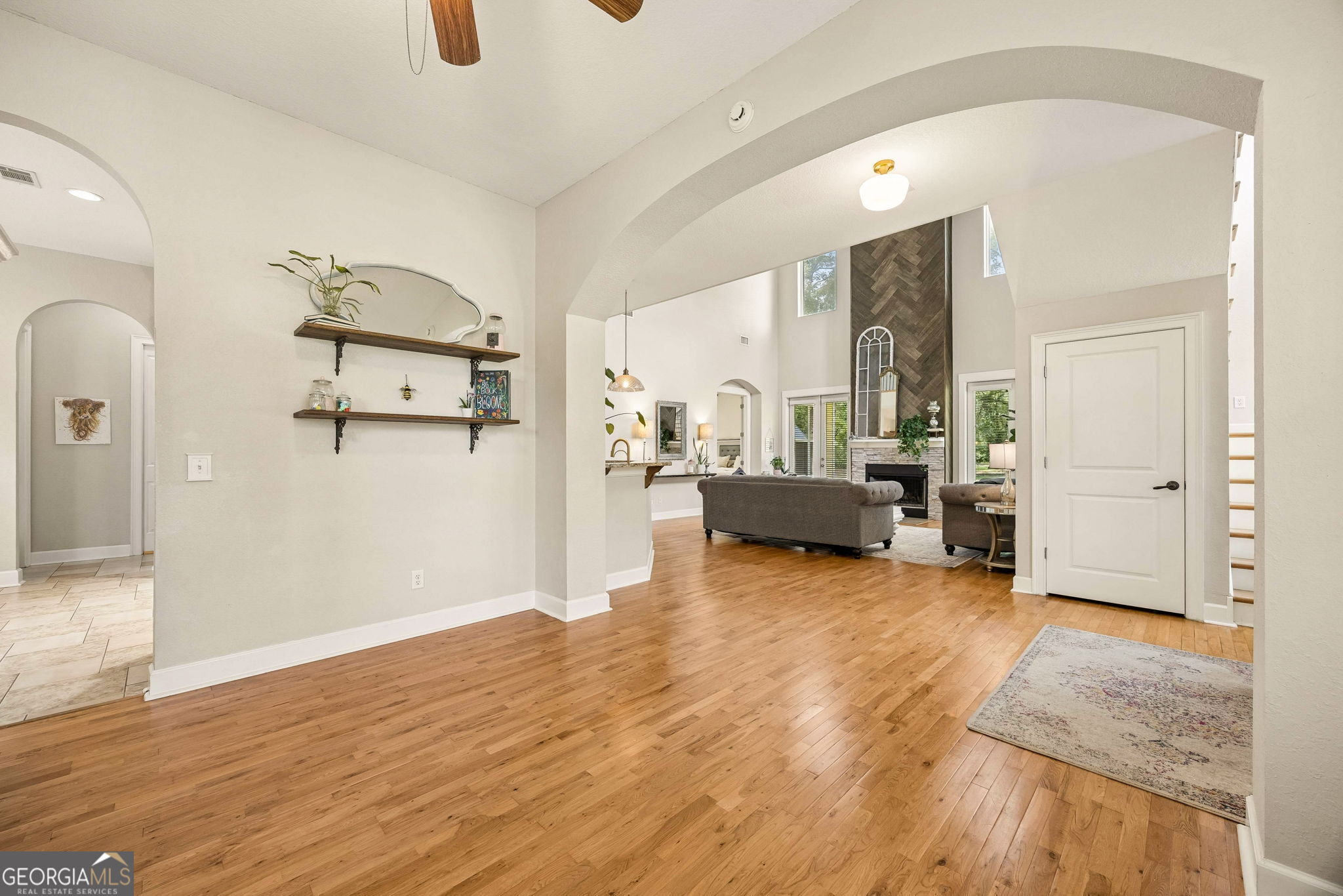706 Hopewell Point Road White Oak, GA 31568 - Photo 12 of 84 Connected to the main living areas through wide arched openings, this versatile space can serve as a library, home office, playroom, or additional sitting room.