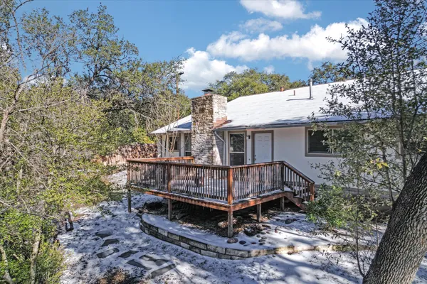 a kitchen with stainless steel appliances kitchen island granite countertop a refrigerator and a stove top oven