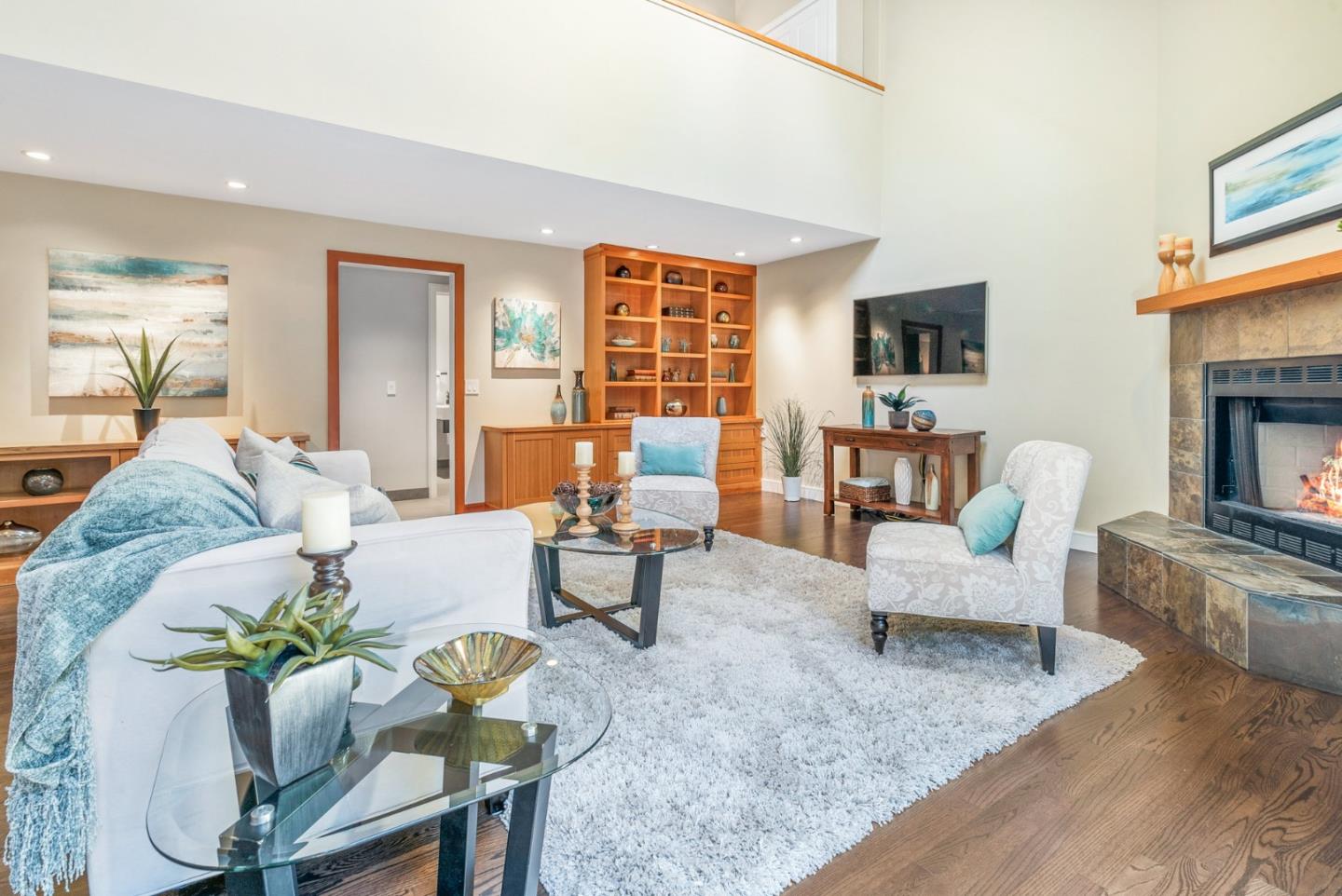 500 Bear Valley Road Aptos, CA 95003 - Photo 36 of 91 a living room with furniture fireplace and a flat screen tv