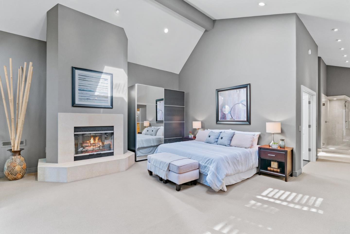 500 Bear Valley Road Aptos, CA 95003 - Photo 43 of 91 a spacious bedroom with a bed and a fireplace