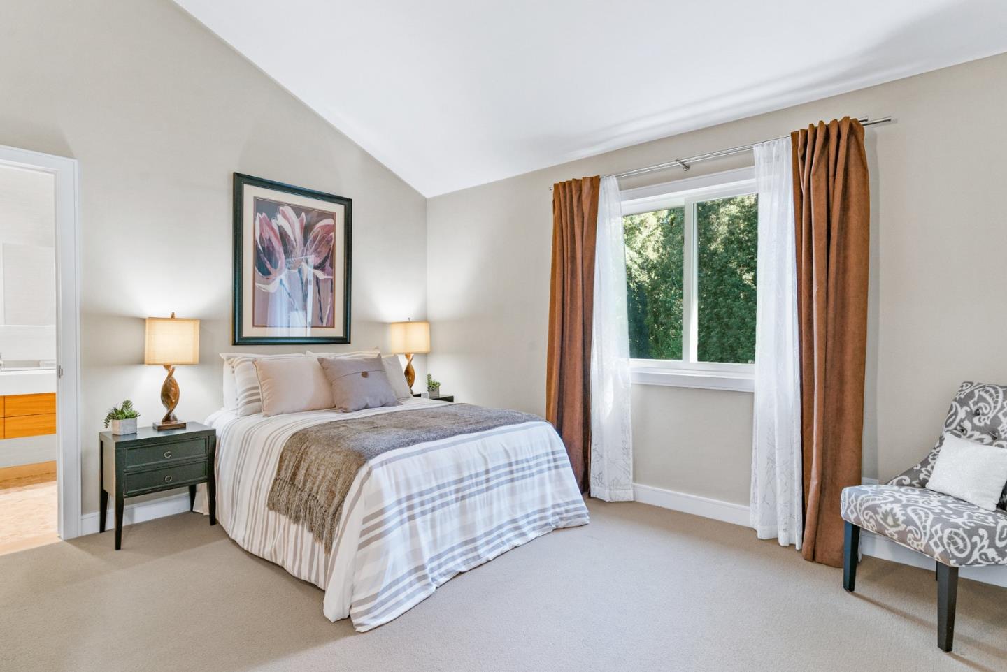 500 Bear Valley Road Aptos, CA 95003 - Photo 55 of 91 a bedroom with a bed and a painting on the wall