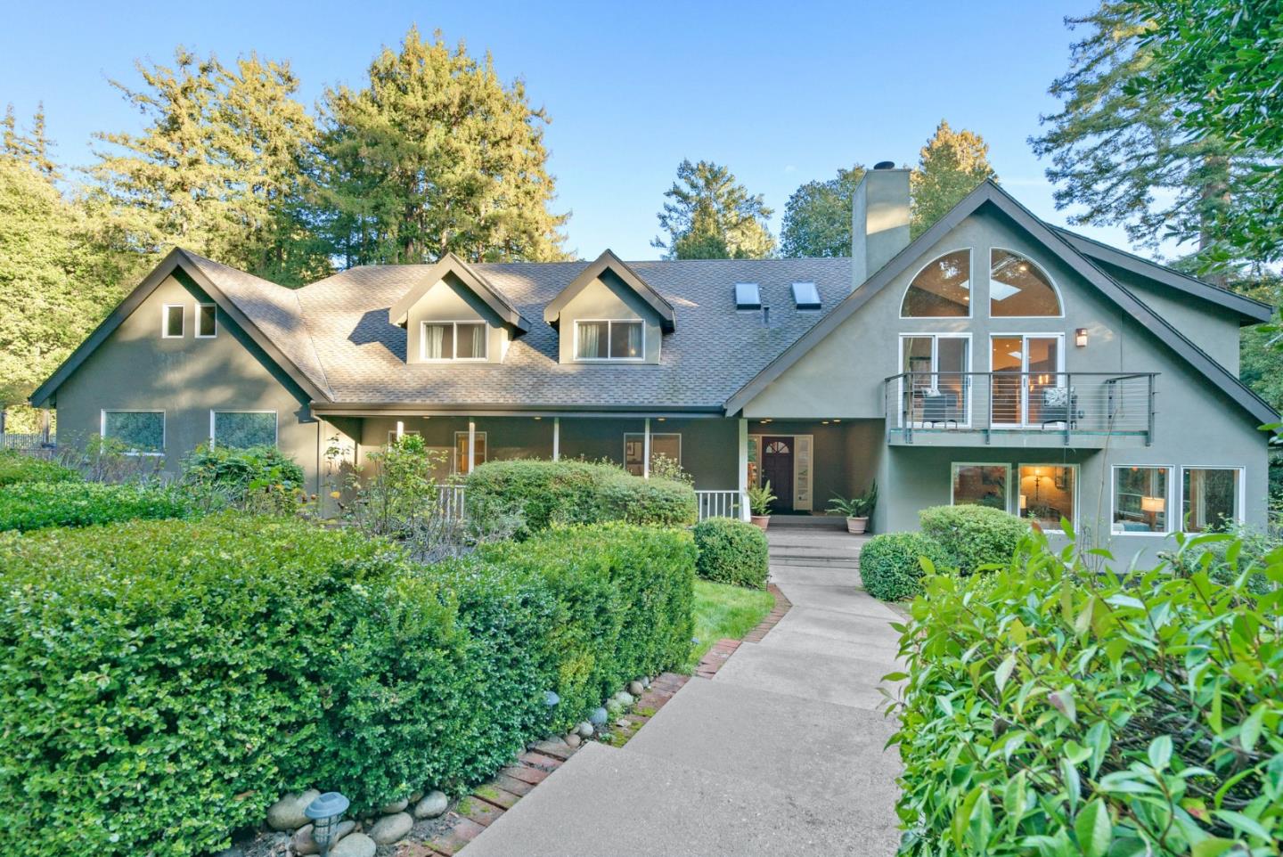500 Bear Valley Road Aptos, CA 95003 - Photo 7 of 91 a front view of a house with a yard and potted plants