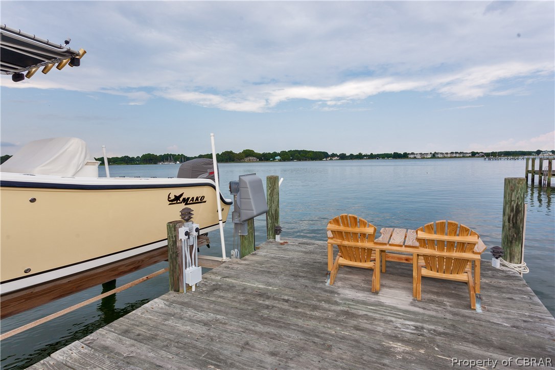 215 McSwain Road White Stone, VA 22578 - Photo 30 of 31 Dock - A gentle stroll to your private dock with water, electricity, a boat and jet ski lift. Deep water and a protected harbor for multiple vessels and of course crabbing for Virginia's finest Blue Crabs.