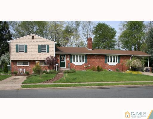 12 Baldwin Road Edison, NJ 08817 - Photo 1 of 10 a front view of a house with a yard