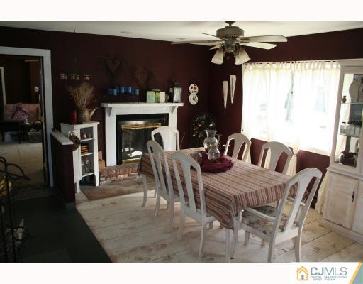 12 Baldwin Road Edison, NJ 08817 - Photo 3 of 10 a view of a dining room with furniture and chandelier