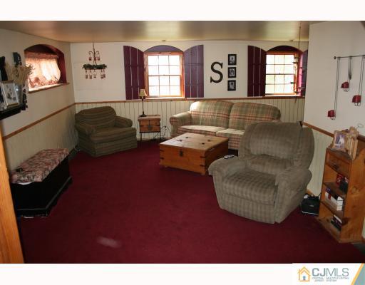 12 Baldwin Road Edison, NJ 08817 - Photo 6 of 10 a living room with furniture and a window