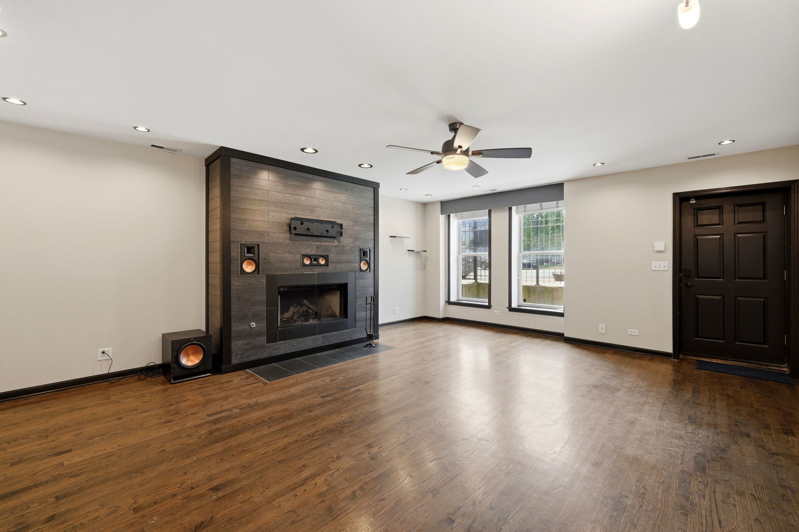619 North Racine Avenue, Unit 1 Chicago, IL 60642 - Photo 12 of 36 a view of an empty room with a fireplace and a window