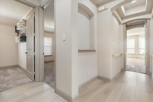 a bathroom with a double vanity sink toilet and a mirror
