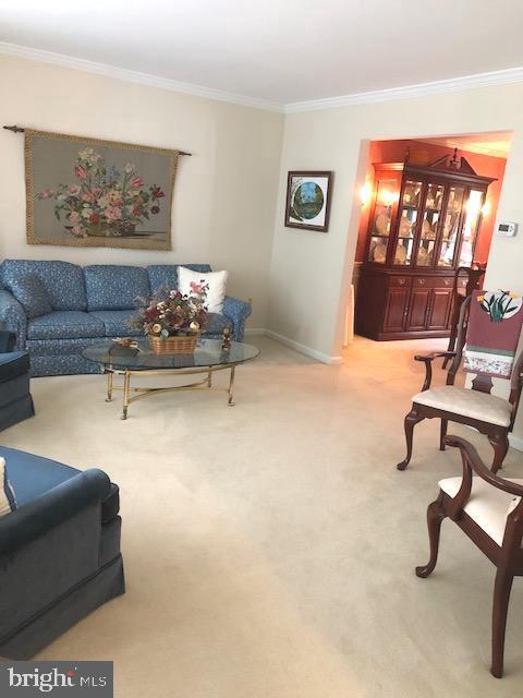 9513 Stoneoak Road Baltimore, MD 21236 - Photo 14 of 36 a living room with furniture and a painting on the wall