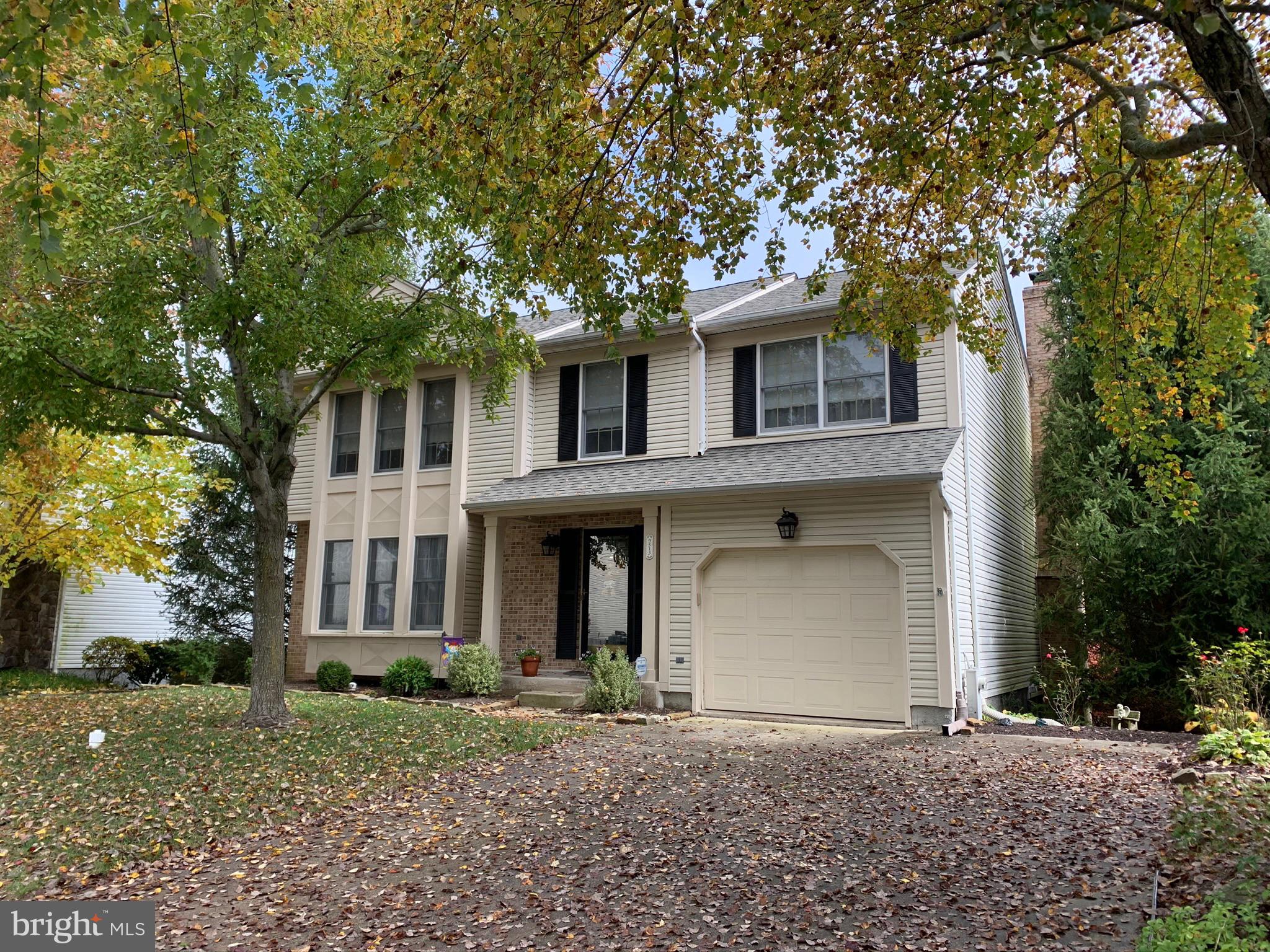 9513 Stoneoak Road Baltimore, MD 21236 - Photo 3 of 36 a front view of a house with garden
