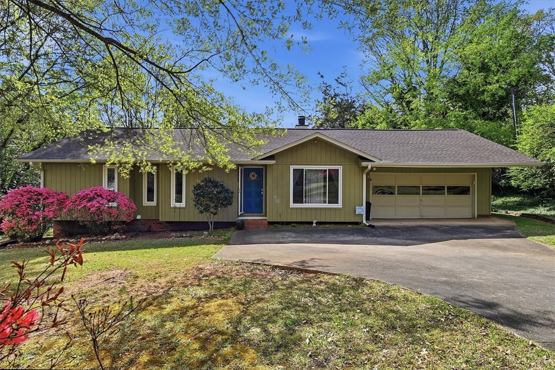 729 State Rd S-37-359 Seneca, SC 29672 - Photo 1 of 35 This charming home offers a convenient attached garage and lush landscaping under a bright sky.