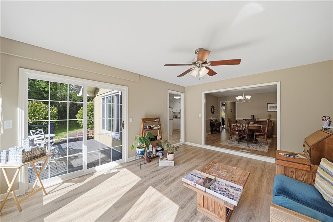 729 State Rd S-37-359 Seneca, SC 29672 - Photo 11 of 35 Bright and airy living space opens to an outdoor deck, perfect for entertaining.