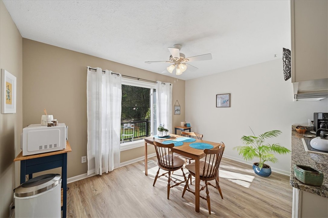 729 State Rd S-37-359 Seneca, SC 29672 - Photo 12 of 35 This inviting dining area features ample natural light and seamless kitchen access for effortless entertaining.