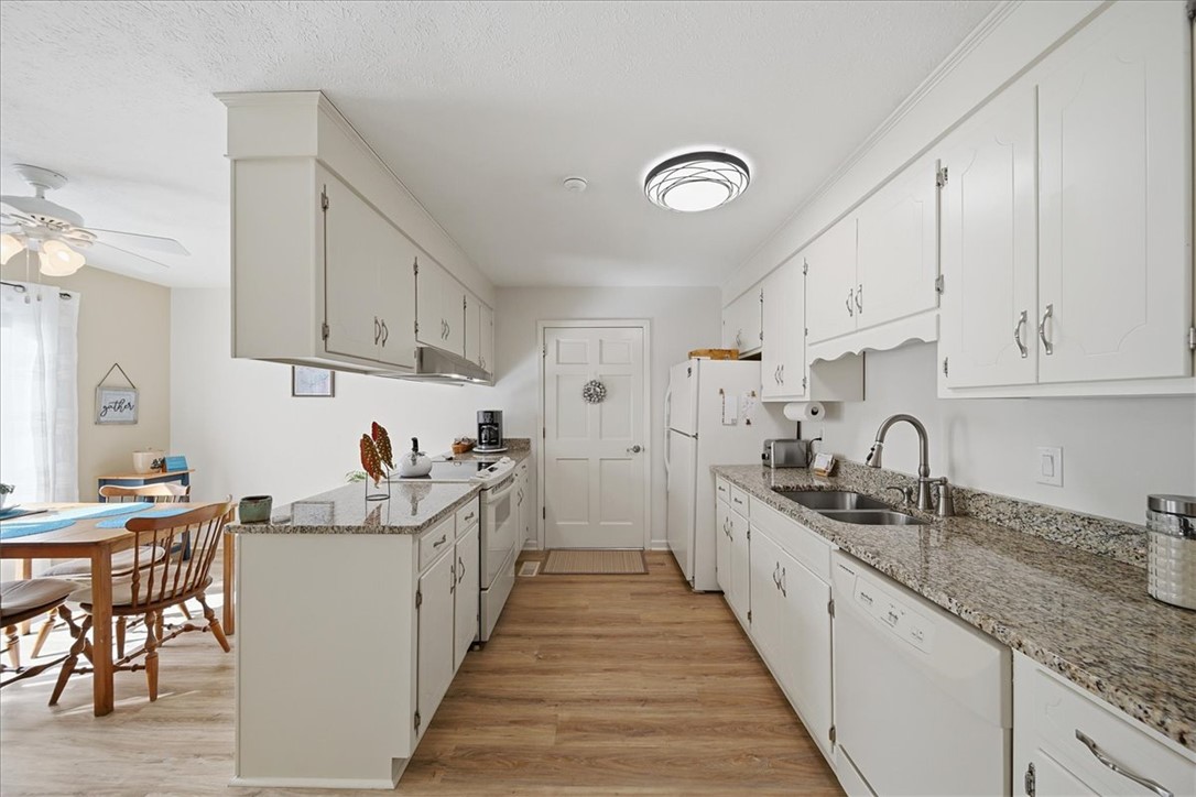 729 State Rd S-37-359 Seneca, SC 29672 - Photo 13 of 35 This bright kitchen offers functional design and a seamless connection to the dining area.