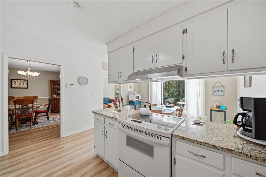 729 State Rd S-37-359 Seneca, SC 29672 - Photo 14 of 35 This spacious kitchen offers ample cabinet space and flows into a bright dining area with outdoor views.