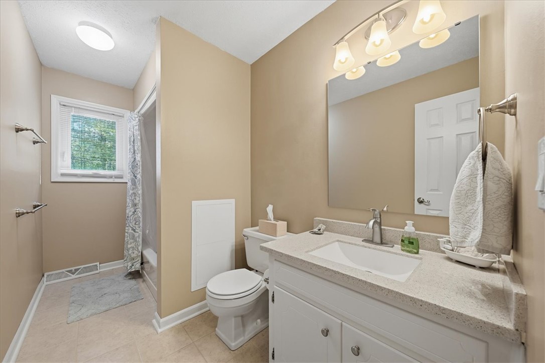 729 State Rd S-37-359 Seneca, SC 29672 - Photo 16 of 35 This bright bathroom features a spacious vanity and a convenient shower area with natural light.