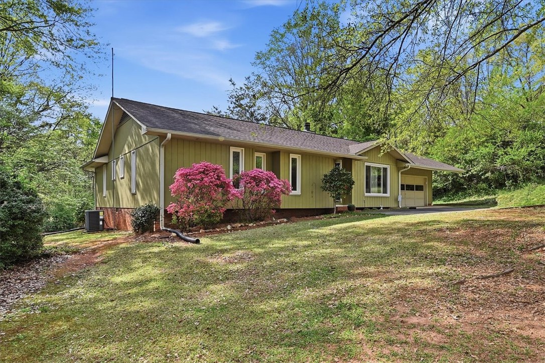 729 State Rd S-37-359 Seneca, SC 29672 - Photo 2 of 35 This charming residence is nestled in a lush, verdant landscape, offering a serene escape.