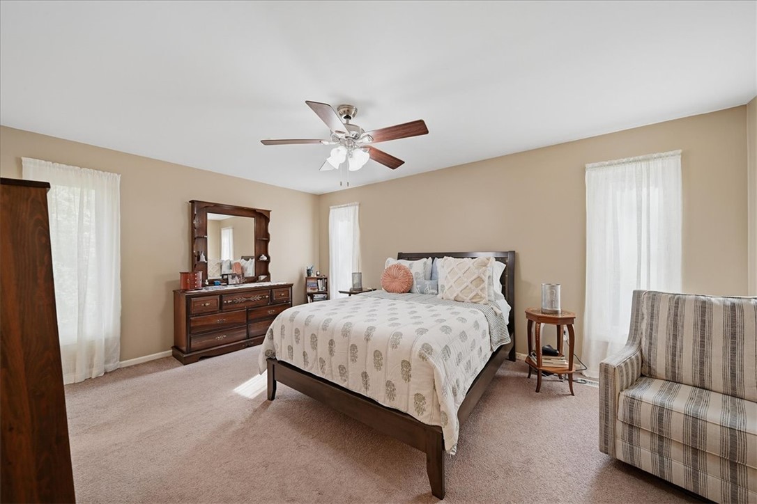 729 State Rd S-37-359 Seneca, SC 29672 - Photo 21 of 35 This inviting bedroom provides a comfortable and spacious retreat with soft carpeting and ample natural light.