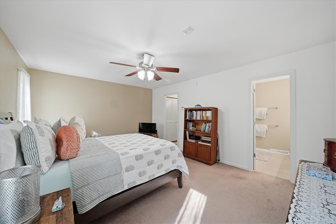729 State Rd S-37-359 Seneca, SC 29672 - Photo 22 of 35 This spacious bedroom offers ample comfort and direct access to a private bath.