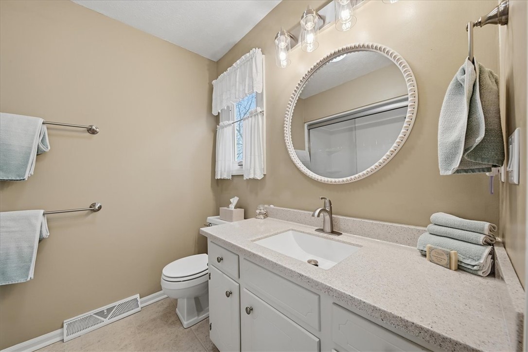 729 State Rd S-37-359 Seneca, SC 29672 - Photo 23 of 35 This bright bathroom features a spacious vanity with ample counter space and a large mirror.