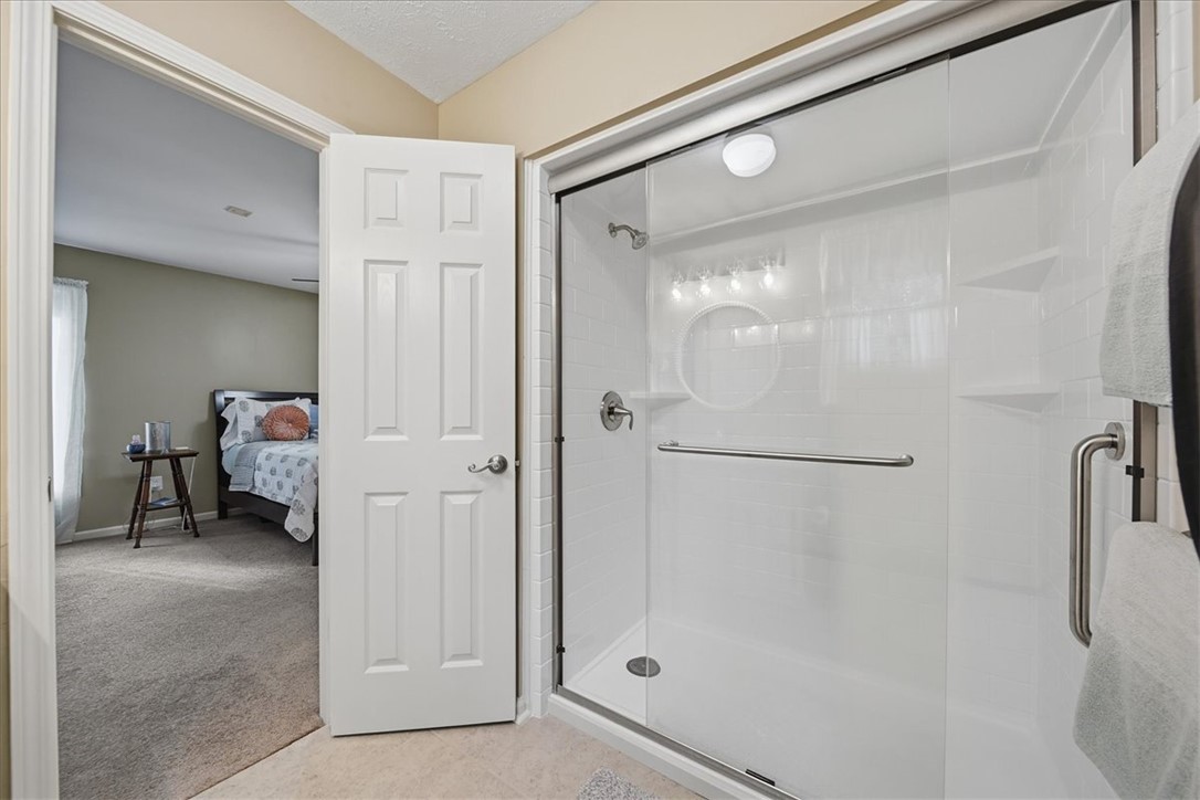 729 State Rd S-37-359 Seneca, SC 29672 - Photo 24 of 35 This primary bathroom offers a convenient walk-in shower and easy access to the bedroom.