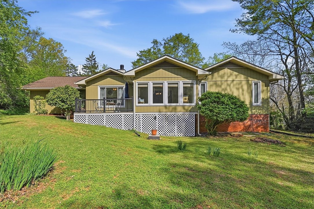 729 State Rd S-37-359 Seneca, SC 29672 - Photo 26 of 35 This residence features a deck and ample yard space, perfect for enjoying outdoor moments.