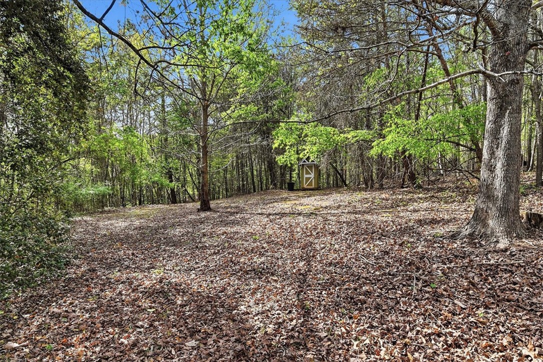 729 State Rd S-37-359 Seneca, SC 29672 - Photo 30 of 35 This tranquil wooded lot offers a peaceful retreat with ample space and a convenient storage shed.