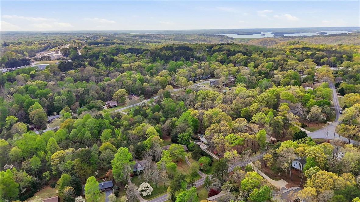 729 State Rd S-37-359 Seneca, SC 29672 - Photo 32 of 35 This elevated view captures a sprawling community nestled amidst a verdant landscape with distant water views.