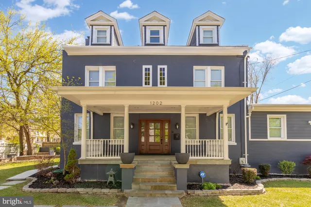 a front view of residential houses with yard